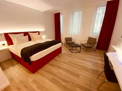 Ein Bett oder Betten in einem Zimmer der Unterkunft DORMERO Hotel Hof