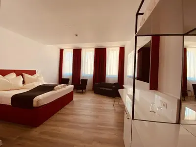 Ein Bett oder Betten in einem Zimmer der Unterkunft DORMERO Hotel Hof