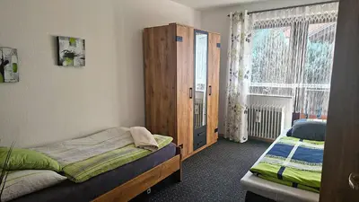 Ein Bett oder Betten in einem Zimmer der Unterkunft Großzügige Wohnung mit Terrasse und Gartenzugang - das komplette Erdgeschoß