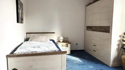 Ein Bett oder Betten in einem Zimmer der Unterkunft Großzügige Wohnung mit Terrasse und Gartenzugang - das komplette Erdgeschoß