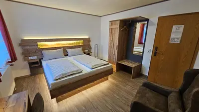 Ein Bett oder Betten in einem Zimmer der Unterkunft Pension Grünhaid