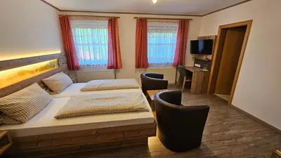 Ein Bett oder Betten in einem Zimmer der Unterkunft Pension Grünhaid