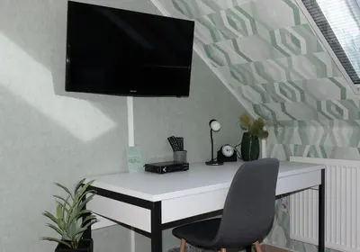 TV/Unterhaltungsangebot in der Unterkunft Moderne, gemütliche DG-Wohnung in ruhiger Lage