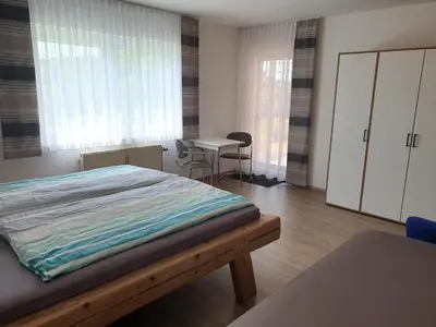 Ein Bett oder Betten in einem Zimmer der Unterkunft Ferienwohnung Schwendner
