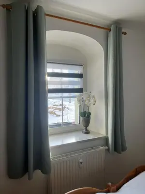 Ein Bett oder Betten in einem Zimmer der Unterkunft Ferienwohnungen Carlsfeld