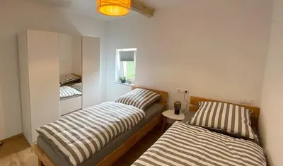Ein Bett oder Betten in einem Zimmer der Unterkunft Ferienwohnungen Fichtelgrün