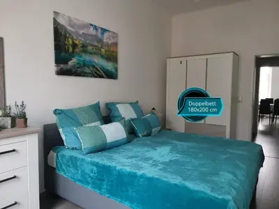 Ein Bett oder Betten in einem Zimmer der Unterkunft MARTHA APARTMENTS - Ideal für Familien und Langzeitaufenthalte