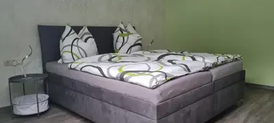 Ein Bett oder Betten in einem Zimmer der Unterkunft Sonnenblick Rittersgrün I