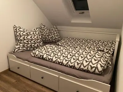 Ein Bett oder Betten in einem Zimmer der Unterkunft Ferienwohnung Auersbergblick