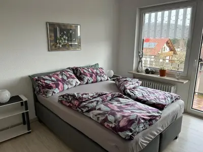 Ein Bett oder Betten in einem Zimmer der Unterkunft Wunderschöne Ferienwohnung in Nagel am See