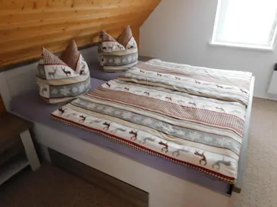 Ein Bett oder Betten in einem Zimmer der Unterkunft Haus Eugen