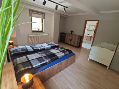 Ein Bett oder Betten in einem Zimmer der Unterkunft VIA MALA Apartment