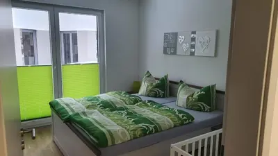 Ein Bett oder Betten in einem Zimmer der Unterkunft Moderne, barrierefreie Ferienwohnung