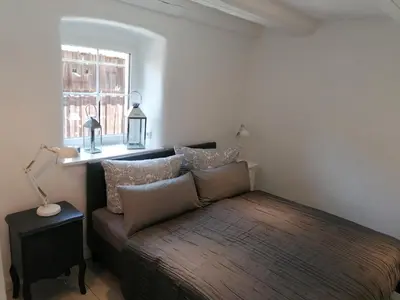 Ein Bett oder Betten in einem Zimmer der Unterkunft Ferienwohnungen Marienweiher