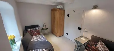 Ein Bett oder Betten in einem Zimmer der Unterkunft Ferienwohnungen Marienweiher