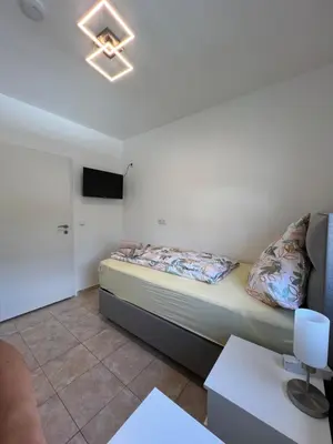 Ein Bett oder Betten in einem Zimmer der Unterkunft Ferienwohnungen Yanev- Hof