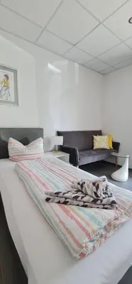 Ein Bett oder Betten in einem Zimmer der Unterkunft Ferienwohnungen Yanev- Hof
