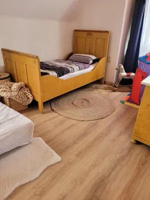 Ein Bett oder Betten in einem Zimmer der Unterkunft Ferienhaus Hildegard & Horst - Urlaub im Herzen des Fichtelgebirge