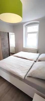 Ein Bett oder Betten in einem Zimmer der Unterkunft Ferienwohnung am Birkenwäldchen