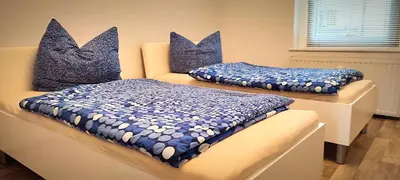 Ein Bett oder Betten in einem Zimmer der Unterkunft Ferienwohnung am Birkenwäldchen