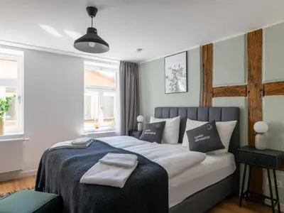 Ein Bett oder Betten in einem Zimmer der Unterkunft Limehome Bayreuth Spitalgasse