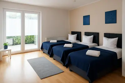 Ein Bett oder Betten in einem Zimmer der Unterkunft SUNNYHOME Monteurwohnungen und Apartments in Weiden