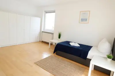 Ein Bett oder Betten in einem Zimmer der Unterkunft SUNNYHOME Monteurwohnungen und Apartments in Weiden