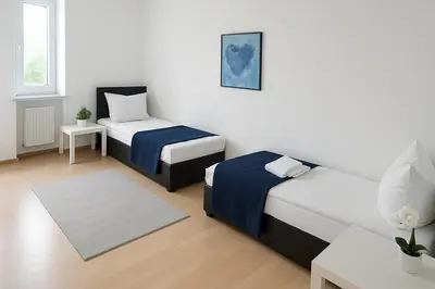 Ein Bett oder Betten in einem Zimmer der Unterkunft SUNNYHOME Monteurwohnungen und Apartments in Weiden
