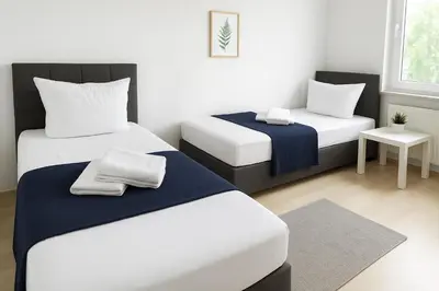 Ein Bett oder Betten in einem Zimmer der Unterkunft SUNNYHOME Monteurwohnungen und Apartments in Weiden