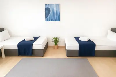 Ein Bett oder Betten in einem Zimmer der Unterkunft SUNNYHOME Monteurwohnungen und Apartments in Weiden