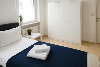 Ein Bett oder Betten in einem Zimmer der Unterkunft SUNNYHOME Monteurwohnungen und Apartments in Weiden