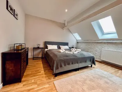 Ein Bett oder Betten in einem Zimmer der Unterkunft Chalet & Apart Fichtelberger Blick
