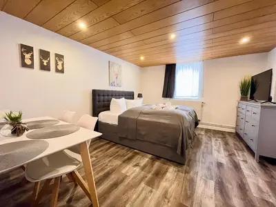 Ein Bett oder Betten in einem Zimmer der Unterkunft Chalet & Apart Fichtelberger Blick