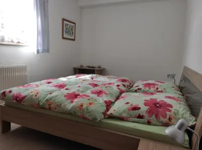 Ein Bett oder Betten in einem Zimmer der Unterkunft Ferienwohnung An der Bimmelbahn - Familie Lange