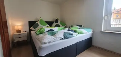 Ein Bett oder Betten in einem Zimmer der Unterkunft Miniferienwohnung am Wiesenweg