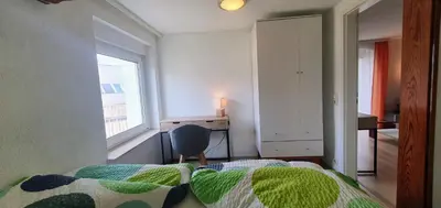 Ein Bett oder Betten in einem Zimmer der Unterkunft Miniferienwohnung am Wiesenweg