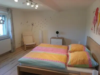 Ein Bett oder Betten in einem Zimmer der Unterkunft Ferienhaus Moni