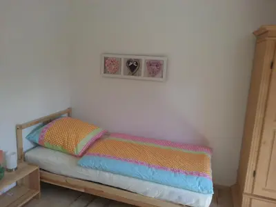 Ein Bett oder Betten in einem Zimmer der Unterkunft Ferienhaus Moni
