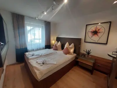 Ein Bett oder Betten in einem Zimmer der Unterkunft Wohnambiente