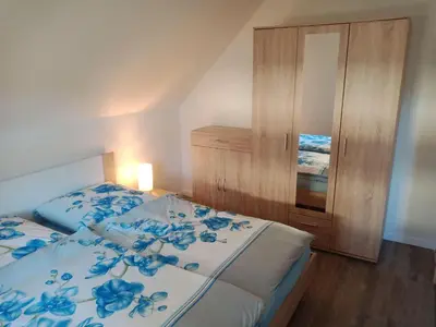 Ein Bett oder Betten in einem Zimmer der Unterkunft Ferienwohnung Rothen-Adler