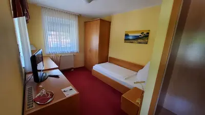 Ein Bett oder Betten in einem Zimmer der Unterkunft Hotel-Café 3 Kronen