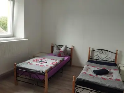 Ein Bett oder Betten in einem Zimmer der Unterkunft Haus Guttenberg