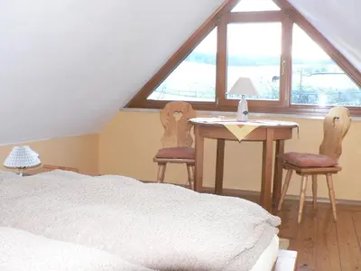 Ein Bett oder Betten in einem Zimmer der Unterkunft Ferienwohnung Teubner