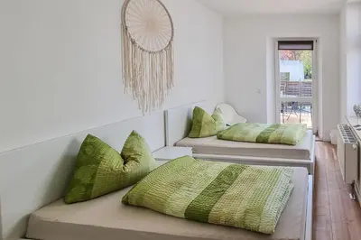 Ein Bett oder Betten in einem Zimmer der Unterkunft malerische Maisonettewohnung mit zwei Balkonen