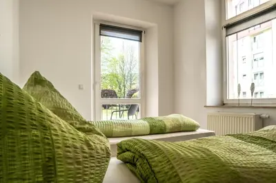 Ein Bett oder Betten in einem Zimmer der Unterkunft malerische Maisonettewohnung mit zwei Balkonen