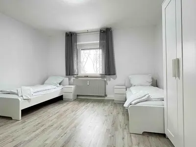 Ein Bett oder Betten in einem Zimmer der Unterkunft SAD190 - Zentrale Moderne Monteurwohnungen