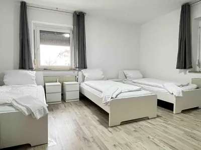 Ein Bett oder Betten in einem Zimmer der Unterkunft SAD190 - Zentrale Moderne Monteurwohnungen