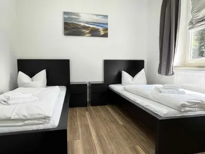 Ein Bett oder Betten in einem Zimmer der Unterkunft SAD190 - Zentrale Moderne Monteurwohnungen