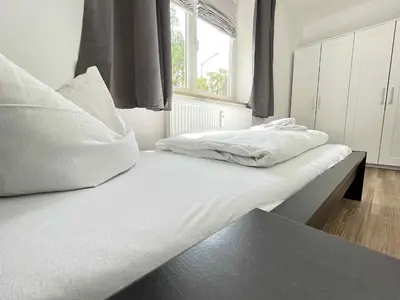 Ein Bett oder Betten in einem Zimmer der Unterkunft SAD190 - Zentrale Moderne Monteurwohnungen