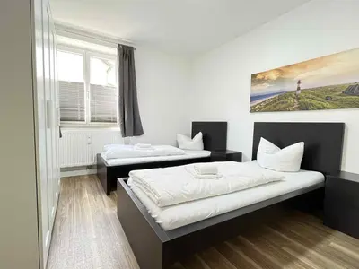 Ein Bett oder Betten in einem Zimmer der Unterkunft SAD190 - Zentrale Moderne Monteurwohnungen